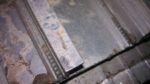 The screws that sheared off or were torn from the door frame when removing the old threshold