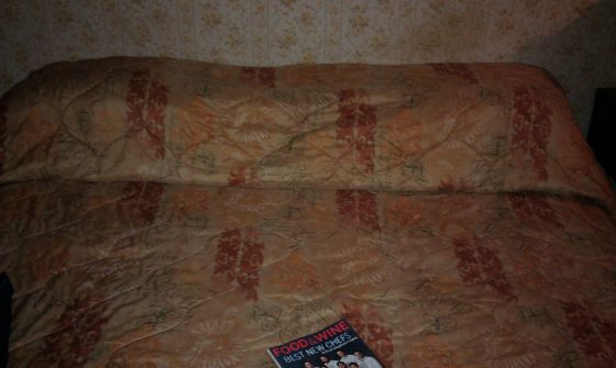 This was our bed. The head was lower than the foot and the pictures hanging above us dropped dust and paint on us.